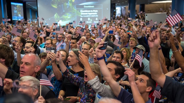 New Horizons crowd waving flags